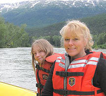 Mother and daughter enjoy a trip in a lifeboat