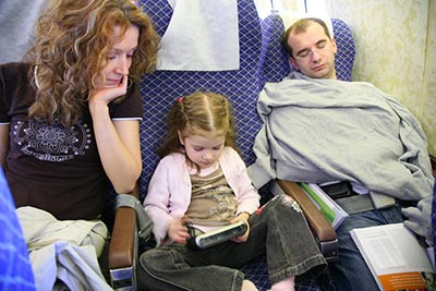 family traveling safely in a plane